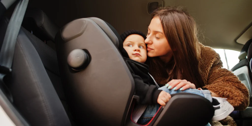woman kissing her child